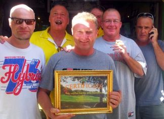 John Mulrooney with well wishers and his albatross certificate.
