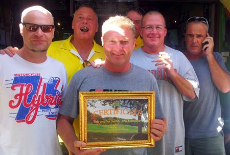 John Mulrooney with well wishers and his albatross certificate.