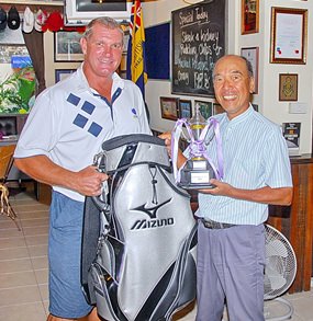 Mashi Kaneta (right) receives his Golfer of the Year trophy and prize from MBMG Group’s Simon Philbrook.