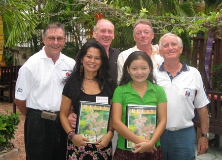 Tuesday winners pose with staff at The Relax Bar.