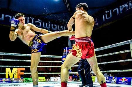 Mathias Sitsongpeenong (left) takes on Juan Mario Kaewsamrit at the Royal Turf Club in Bangkok, July 26, 2013.