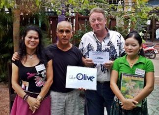 Bartley is player of the month Mukesh Thakkar (2nd left) presents the Blue Olive monthly award to John Bartley (2nd right).