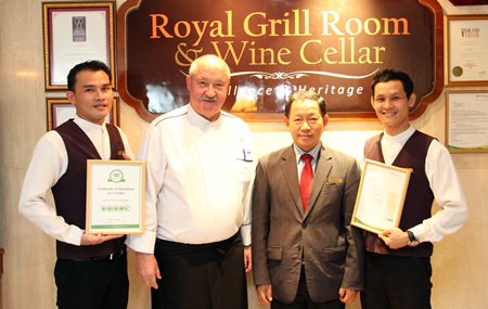 Royal Cliff Hotels Group Executive Chef Walter Thenisch (second left), Food & Beverage Director Paitoon Ritdej (second right), Restaurant Manager Vichai Pooalai (right), and Assistant Restaurant Manager Vinyoo Rosdee (left) proudly display their award.