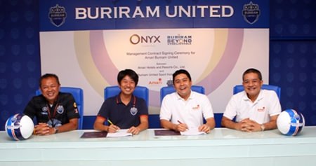 Newin Chidchob (left) poses with representatives of Buriram United Football Club and ONYX Hospitality Group at a press conference to announce the new football themed hotel.