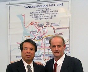 Stuart poses in front of the plan for the YangMingShan MRT Line, with Johnson Lee, President of AMACorp. in Taipei.