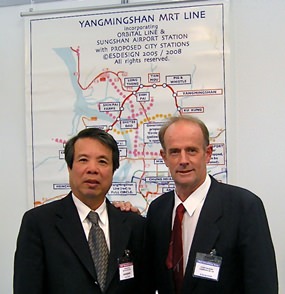 Stuart poses in front of the plan for the YangMingShan MRT Line, with Johnson Lee, President of AMACorp. in Taipei.