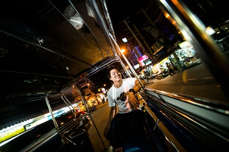 Hard Rock Hotel’s Vibe manager, Quest, taking in the sights in a songthaew.