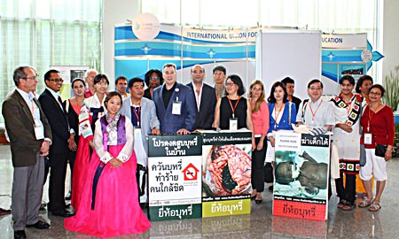 IUHPE President Michael Sparks (center, with large white ID badge), poses with representatives from health promotion organizations after having signed the petition to increase hazardous warnings on cigarette packs.