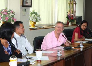 Mark Capaldi (center), chief of research and policy for ECPAT International, listens to stories and problems associated with child migration.