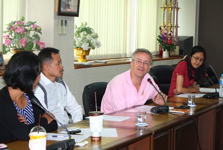 Mark Capaldi (center), chief of research and policy for ECPAT International, listens to stories and problems associated with child migration.