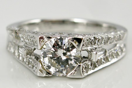 Diamond ring 18 carat white gold with 70 diamonds surrounding center stone, 90 points in total donated by Steve Hanchon.