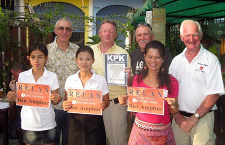 Tuesday’s winners pose with staff at The Relax Bar.