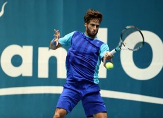 Spain’s Feliciano Lopez hits a forehand against Laslo Djere of Serbia during the first round of the 2013 Thailand Open tennis tournament in Bangkok, Monday, Sept. 23.