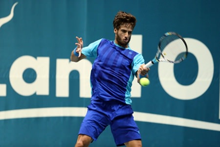 Spain’s Feliciano Lopez hits a forehand against Laslo Djere of Serbia during the first round of the 2013 Thailand Open tennis tournament in Bangkok, Monday, Sept. 23.