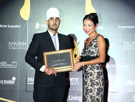 Vasant Chawla (left), CEO of Quality Condominium Co., Ltd., accepts the award for Best Residential Development (Chiang Mai) for The Resort Condominium.