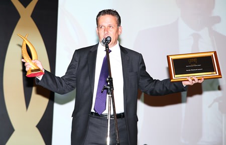 Mark Price, CEO of Savills (Thailand) Ltd. takes the applause after his company was named Best Overseas Agent.