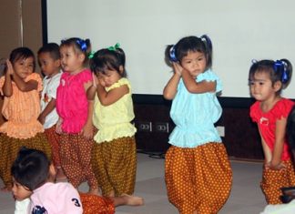 “Mini’s” from the North Star Library and Father Ray Community Center perform the “nong-pee-seuah” (“Caterpillar show”) dance their little bodies on stage as a special entertainment during the “Smart Baby Smart Brain” program at the Bangkok Hospital Pattaya.
