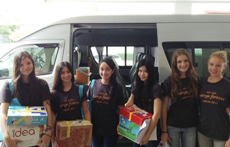 St. Andrews students arrive with boxes of goodies for the children.