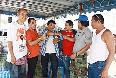He just wanted to help - Jakrit Mukpradap (center) was arrested for drug possession when trying to donate ya ba to the flood relief effort.