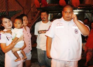 Rescue workers bring the child to safety.