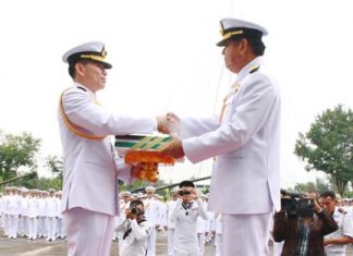 ACDC chief Rear Adm. Noppadol Suphakorn hands over administrative documents to Rear Adm. Luechai Ruddit, bestowing command of the Air and Coastal Defense Command in Sattahip.