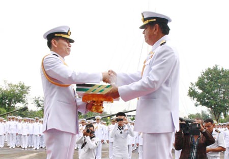ACDC chief Rear Adm. Noppadol Suphakorn hands over administrative documents to Rear Adm. Luechai Ruddit, bestowing command of the Air and Coastal Defense Command in Sattahip.