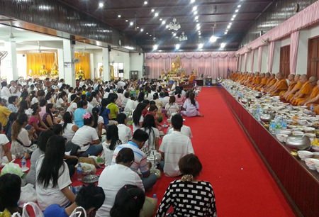 Buddhists offer alms at Wat Chaimongkol Phra Aaramluang, South Pattaya.