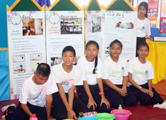 Students at Pattaya School #8 tend one of the booths set up as part of the school’s 86th anniversary and exhibition on the ASEAN Economic Community.