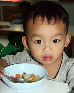 A nutritious breakfast awaits the toddlers at the Father Ray Day Care Center.