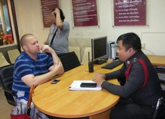 Thorsten Beinotat reports to police that he was pickpocketed on Beach Road.