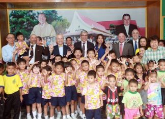 French Ambassador H.E. Thierry Viteau and his aides pose for a fun group photo with children and administrators of the Pattaya Orphanage.