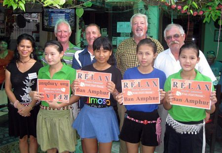 Tuesday’s winners pose with the staff at The Relax Bar.