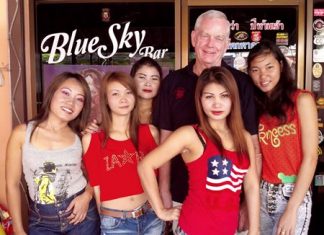 Don ‘the Divorcer’ (2nd right rear) celebrates his win with the staff at Blue Sky Bar.