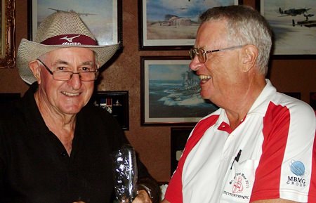 Dick Warberg (right) presents the MBMG Group Golfer of the Month award to Barry Oats. 