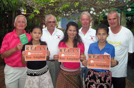 Tuesday’s winners (Stuart Gordon far left) pose for a photo with the staff at the Relax Bar. 