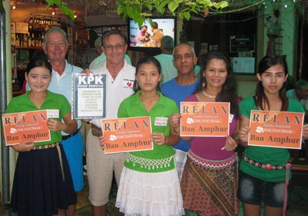 Tuesday winners celebrate with the staff at The Relax Bar.