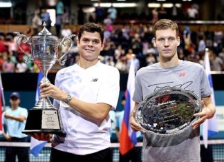 Milos Raonic (left) hoists the champion’s trophy after defeating Tomas Berdych (right) in the final of the Thailand Open 2013 in Bangkok, Sunday, Sept. 29.