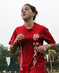 A young athlete gives her all at the ESAC Cross-Country Championships.