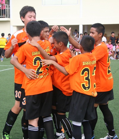 Pattaya team Black Ant FC celebrate after winning a penalty shoot-out.