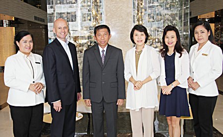 Dominique Ronge (2nd left), general manager of Centara Grand Phratamnak Pattaya and Kanokros Sakdanares (2nd right), corporate director of marketing communications of Centara Hotels & Resorts, welcome Admiral Taweewuth Pongsapipatt (3rd left), Chief of Staff, Royal Thai Navy and his wife, Captain Doctor Woranart Pongsapipatt, Royal Thai Navy (3rd right) on their arrival to stay at the newly opened resort as the first guests. The hotel soft opened on 15th October. Also seen in the photo are Wassana Pokthang (far left), executive assistant manager and Chananchida Wongsa-ard (far right), sales and public relations manager of Centara Grand Phratamnak Pattaya.