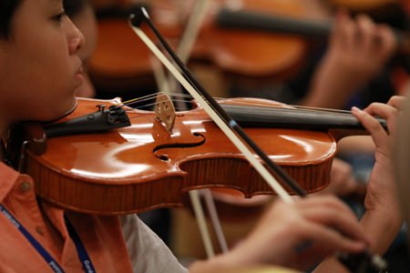 A budding violinist plays during the festival.
