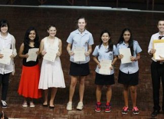 GIS talented musicians receive their ABRSM certificates from Head of Arts Mr Shiells.