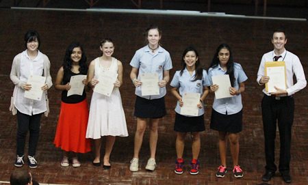 GIS talented musicians receive their ABRSM certificates from Head of Arts Mr Shiells.