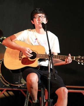 A GIS student plays an Oasis classic at a recent concert.