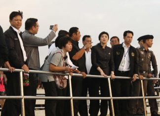 The look of concern shows on Prime Minister Yingluck Shinawatra (Front row 3rd right) as officials explain what happened when an overcrowded ferry operated by Koh Larn Travel and being captained by a man who confessed to being high on methamphetamines capsized, killing six tourists; 3 Thais, 2 Polish and 1 Hong Kong Chinese.