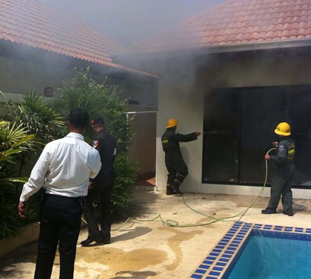 Firefighters tend to one of two fires at View Talay Villas which they believe might have been set to mask a burglary.