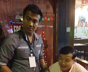 Bangladeshi, Thais arrested for alleged protection scam against expats Police take the 9mm handgun and ID from Yuthana Khanthong during his arrest.