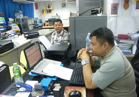 Boat owner Jaruk Ngamkaew gives his statement of ownership of the boat to the investigation officer at Pattaya police station.