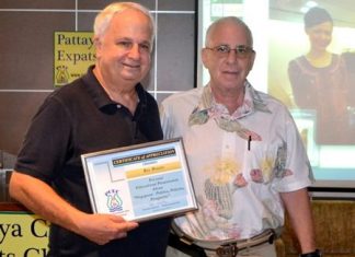 MC Richard Silverberg presents Rey with a Certificate of Appreciation as thanks for his insightful presentation.