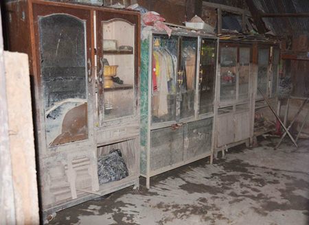 Flood soaked wardrobe and clothes.